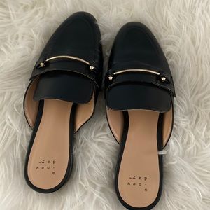 Black leather mules with Gold accent